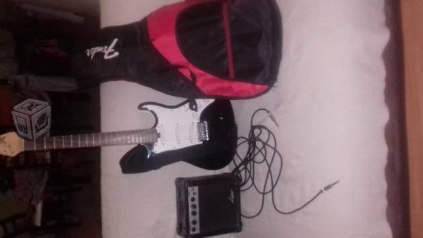 Guitarra electrica con funda y amplificador